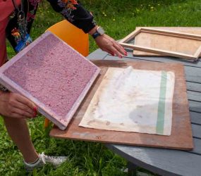 turning the paper pulp sheet out onto the couching cloth