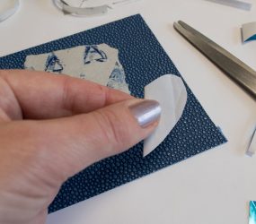 folding the heart cut out shape in half to cut