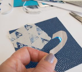 folding the heart cut out shape in half to cut