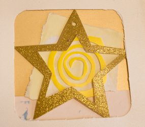 cut out gold star and yellow swirl abstract collage