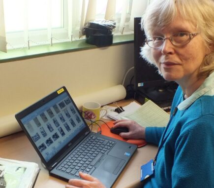 Anne entering details on to history collection database