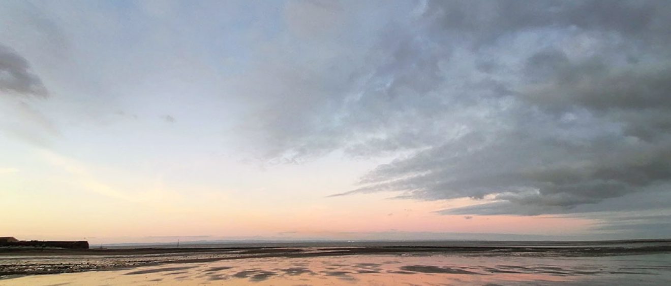 sun rising over mud flats West Somerset shoreline