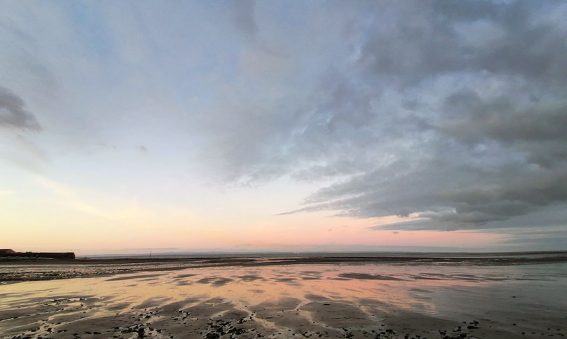 sun rising over mud flats West Somerset shoreline