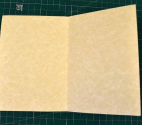 A4 paper folded in half again and opened out