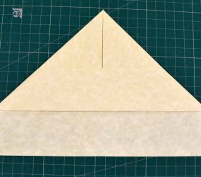 folding corners of bottom flap over