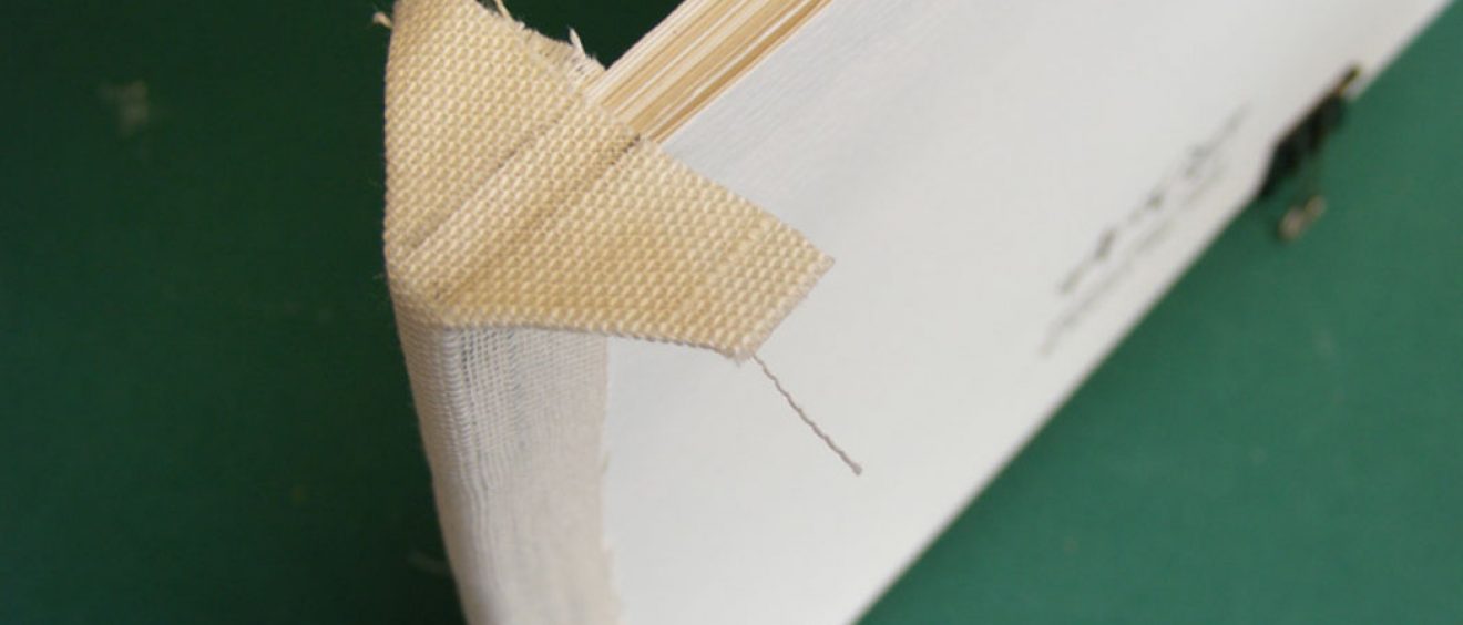 Glue the decorative spine cover in place