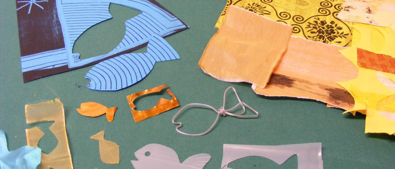 Choose papers and cut out shapes for layering onto the background