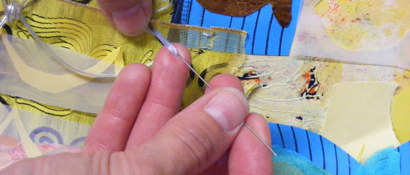 The stitching adds interest to the collage too