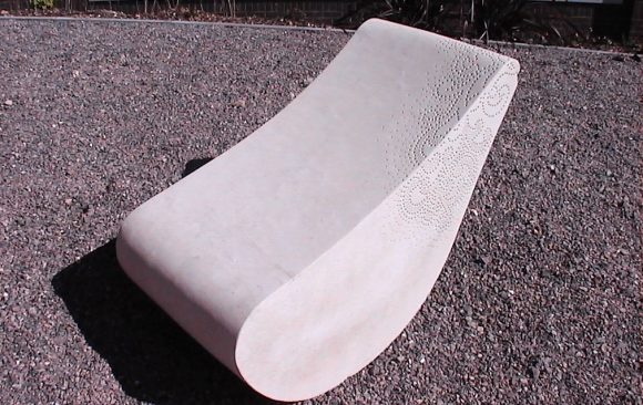 Carved stone seat with surface detail pattern