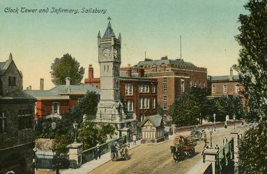 horse drawn carriages passing in front of clock tower early 20th century