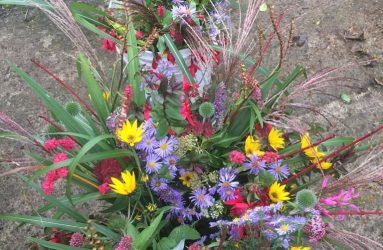 brightly coloured seasonal flowers hand-tied