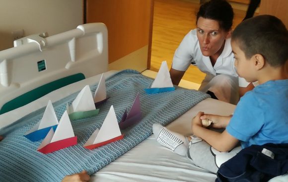 Origami boats on patients bed