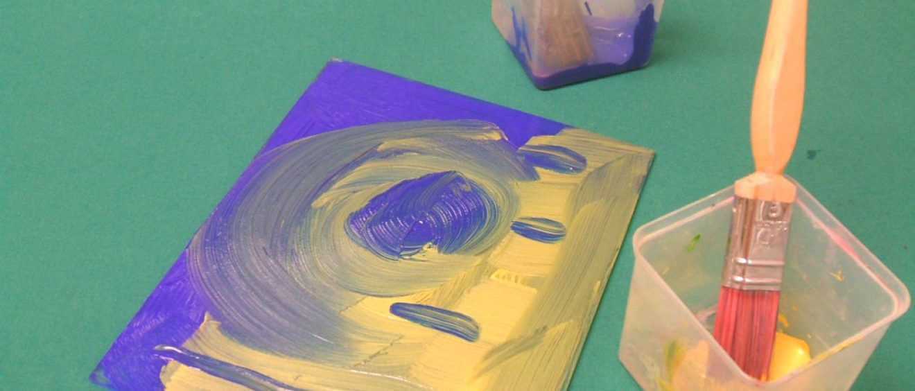 Apply paint to your plastic mat