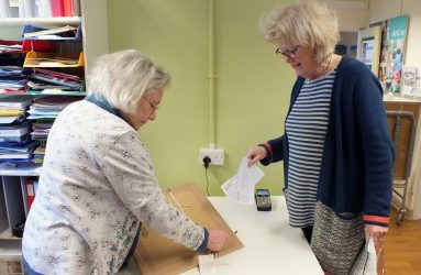 Pam taking delivery of artwork entry