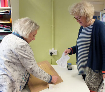 Pam taking delivery of artwork entry