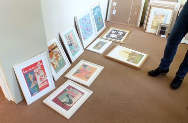 entries arranged on floor for viewing and selection