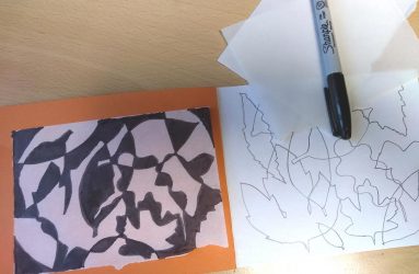 overlapping leaf outlines, some spaces shaded to create abstract design