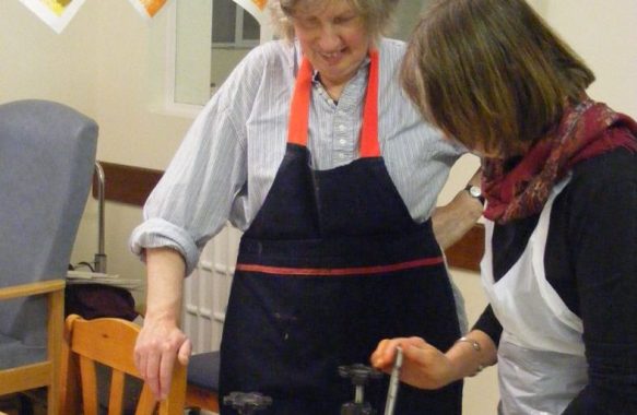 Ruth Oaks demonstrating printing press
