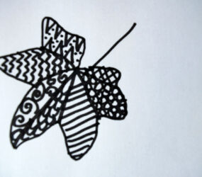 outline of leaf outline in black pen, filled in with zigzag lines and dots